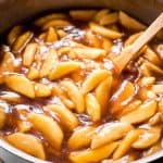 close up of homemade apple pie filling in skillet