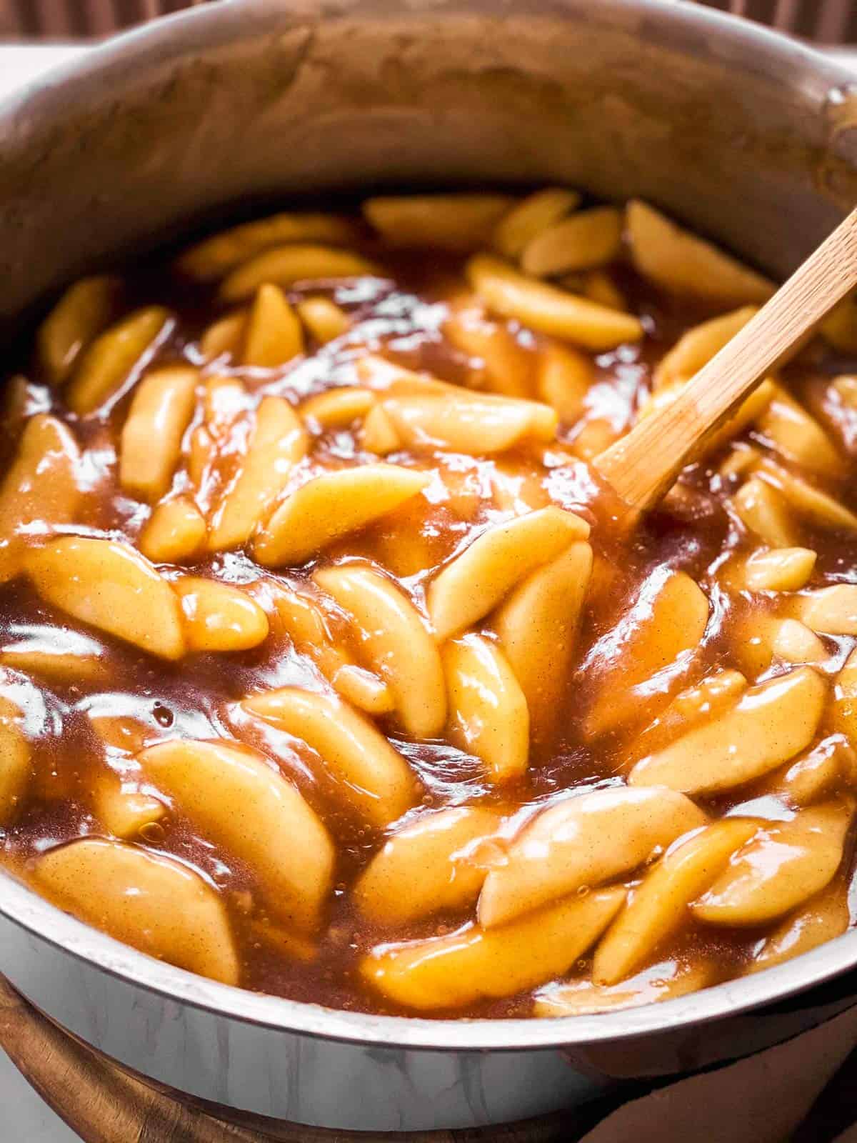 close up of homemade apple pie filling in skillet