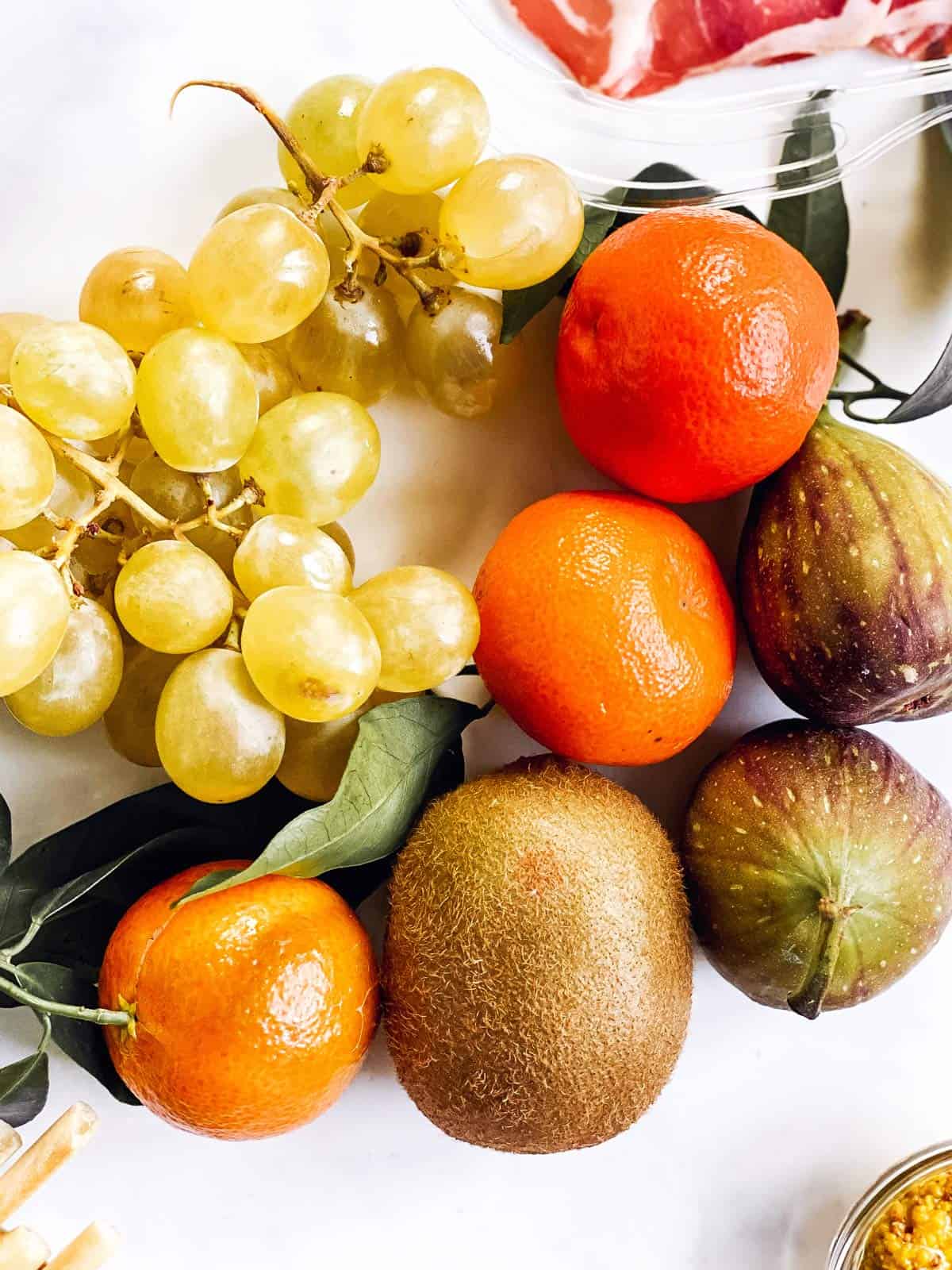 several types of fruit on bright white surface