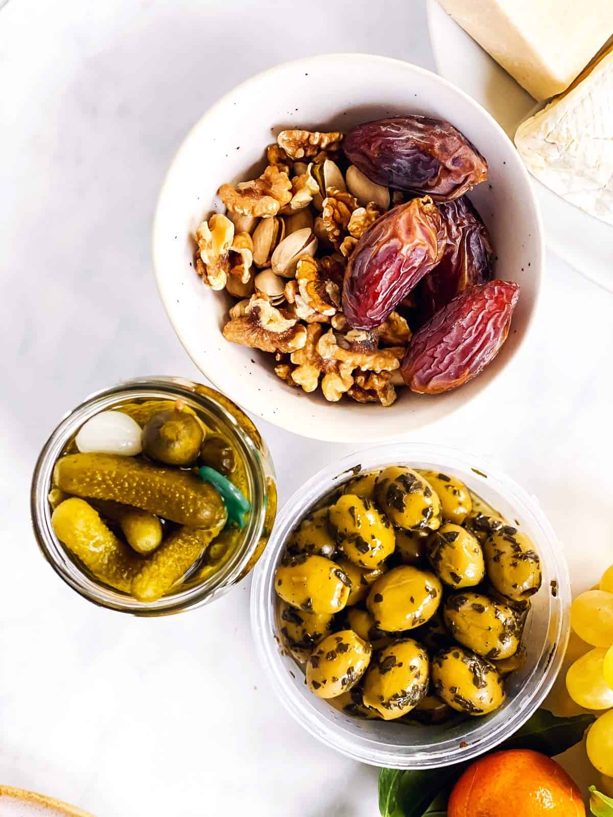 various nibbles in bowls on white surface