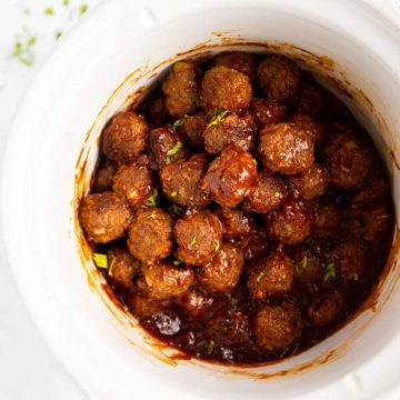 overhead view of bbq meatballs in white crock