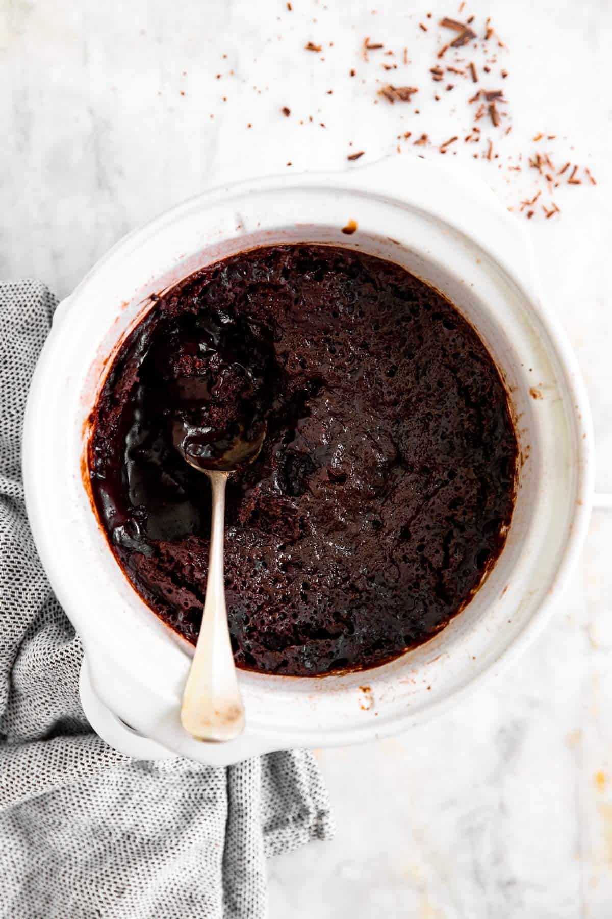 overhead view of white crock with chocolate pudding cake