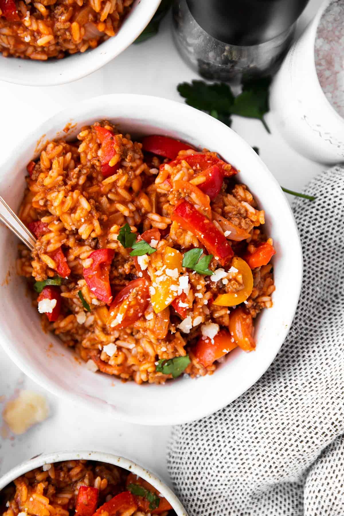 bowl with unstuffed pepper skillet on light surface