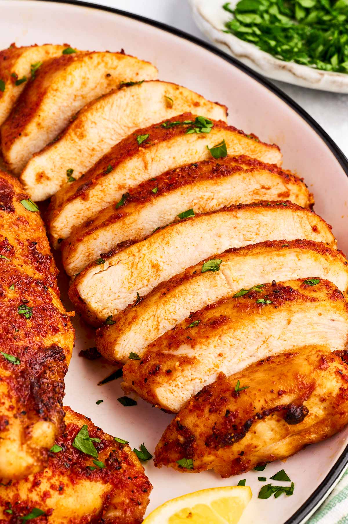 Sliced chicken breast on a plate.