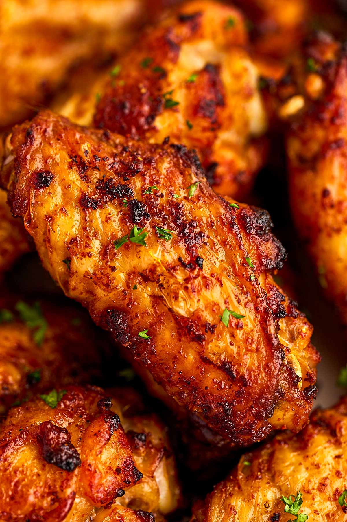 Close up of an air fried chicken wing.