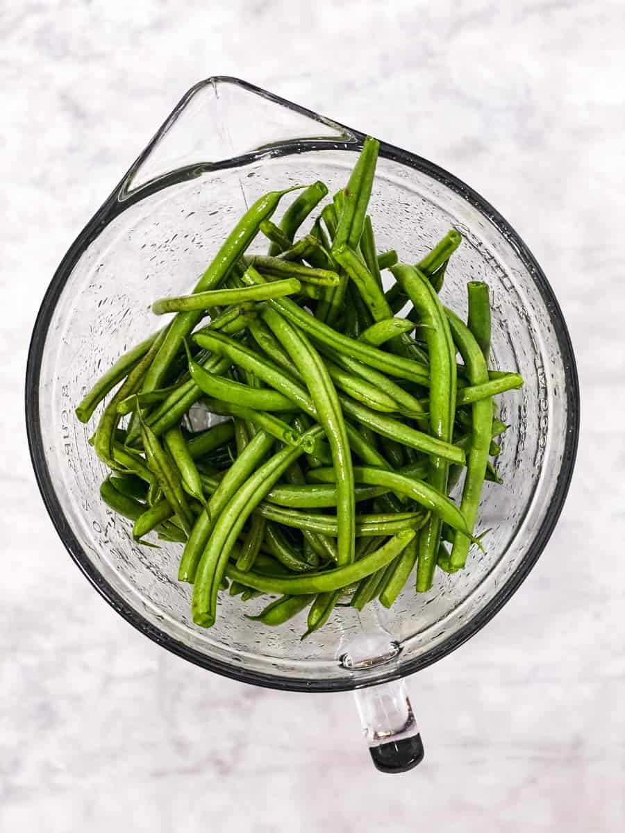 glass bowl with raw green beans