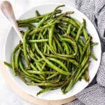 overhead view of white plate with air fried green beans