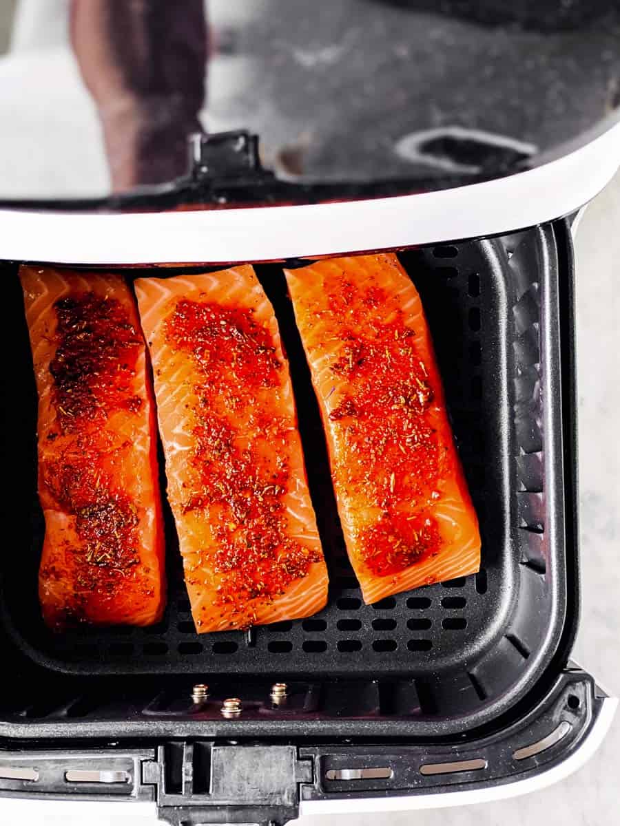 raw salmon in air fryer basket