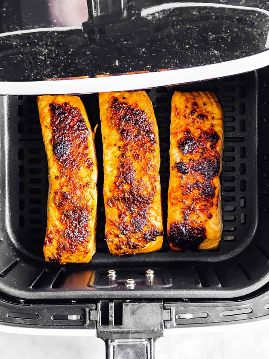 cooked salmon in air fryer basket