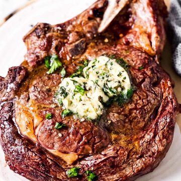 close up photo of steak with garlic herb butter