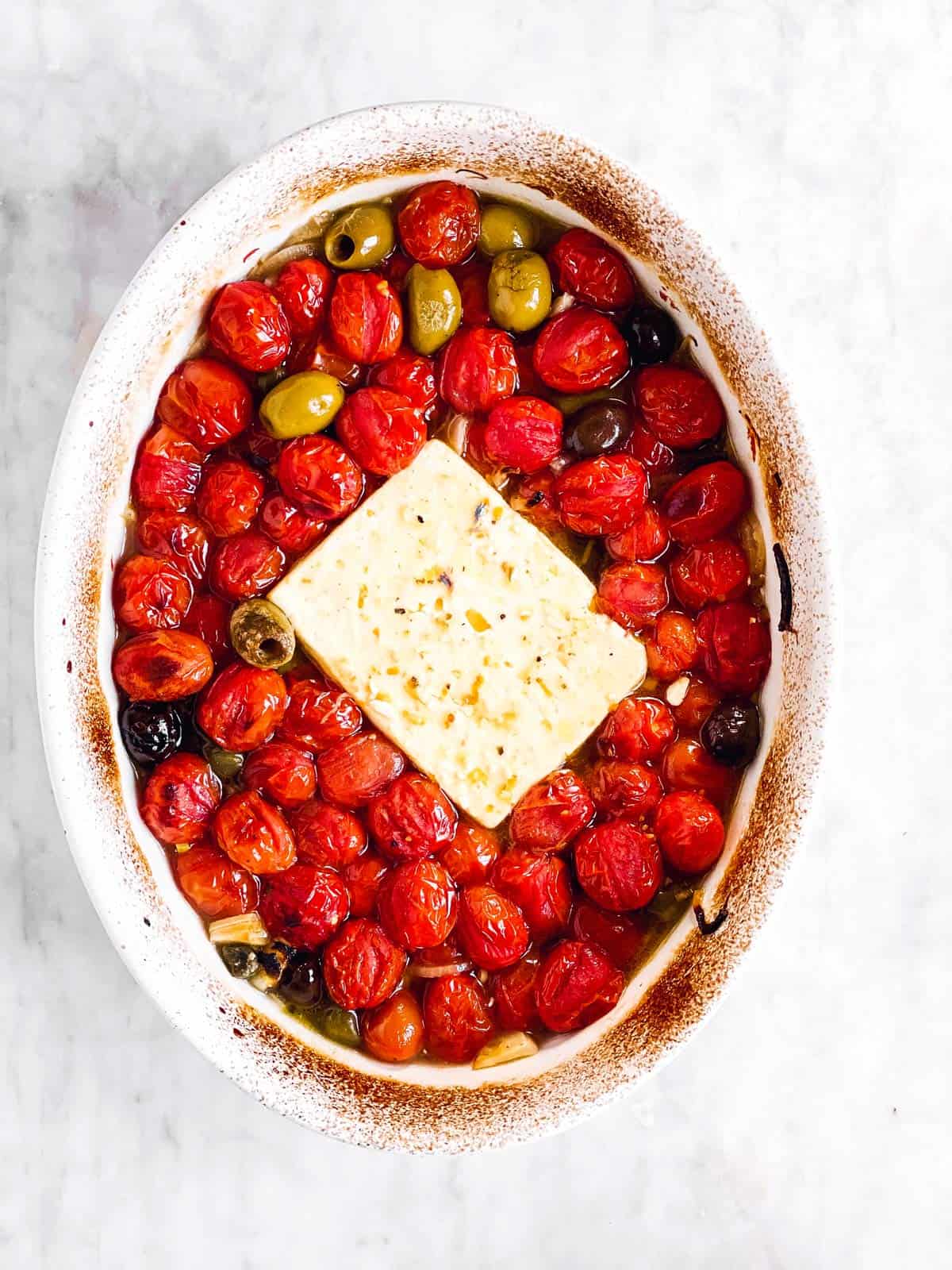 baked tomatoes and Feta in white baking dish