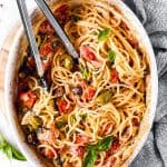 white casserole dish filled with baked feta pasta