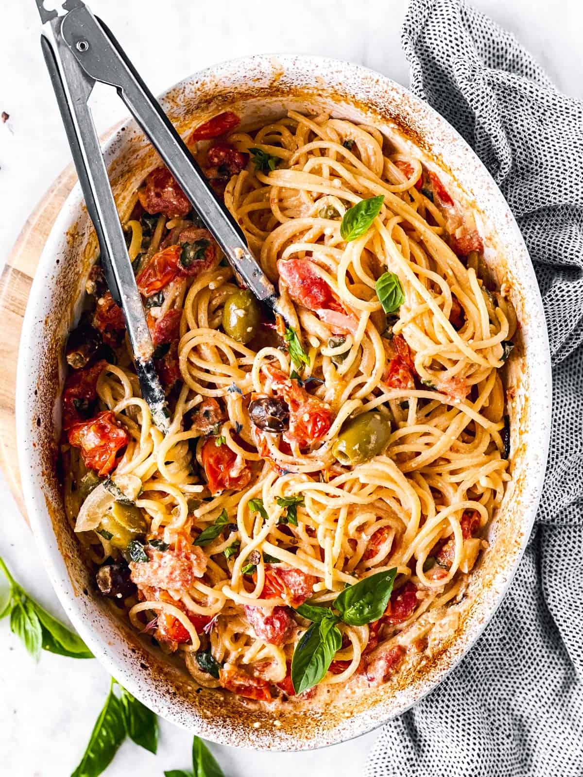 white casserole dish filled with baked feta pasta 