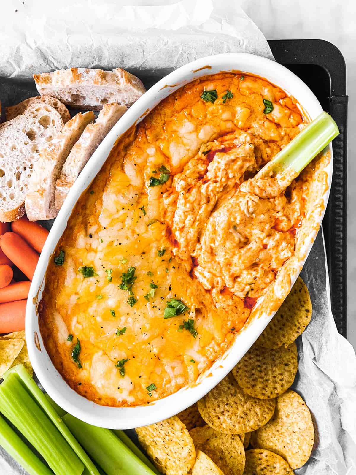 overhead view of baking dish filled with buffalo chicken dip