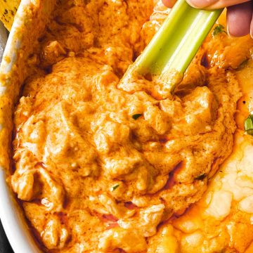 celery stick dipped in buffalo chicken dip