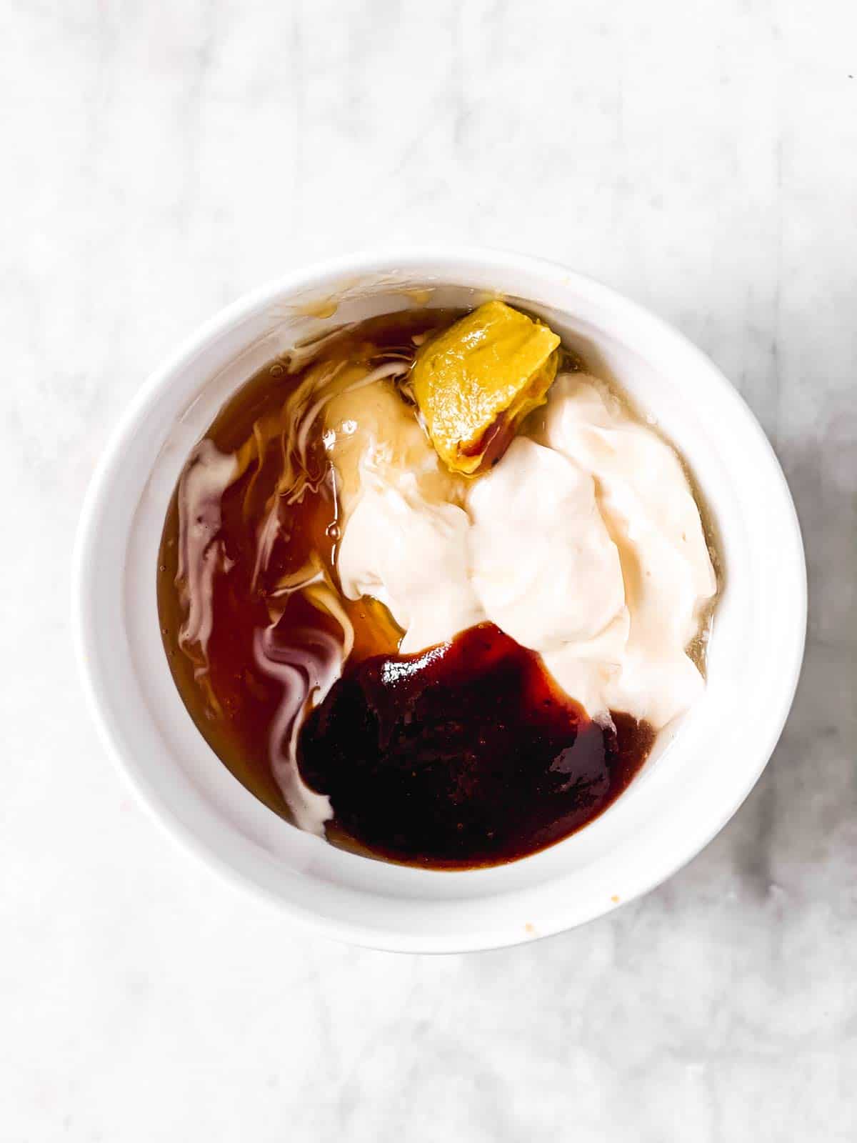 white bowl with ingredients for copycat chick-fil-a sauce