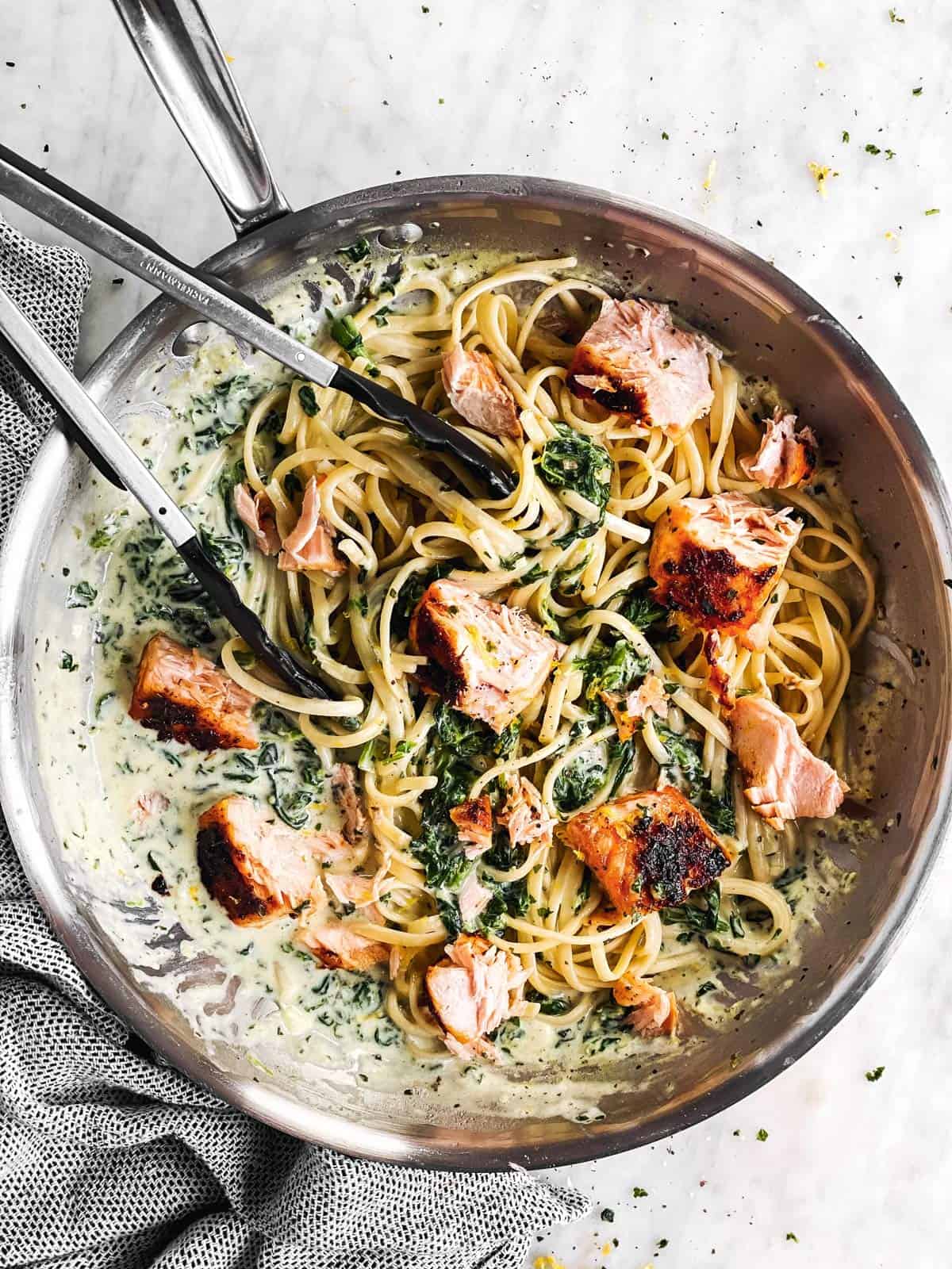 overhead view of skillet with creamy salmon pasta