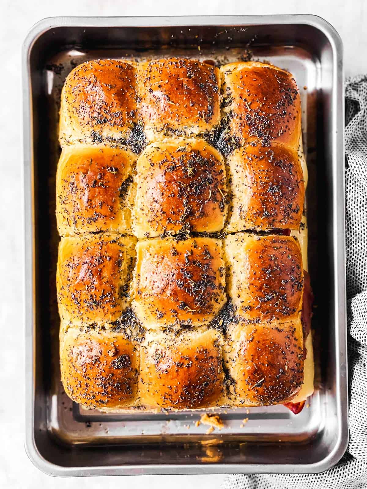 baked hot ham sliders in metal pan