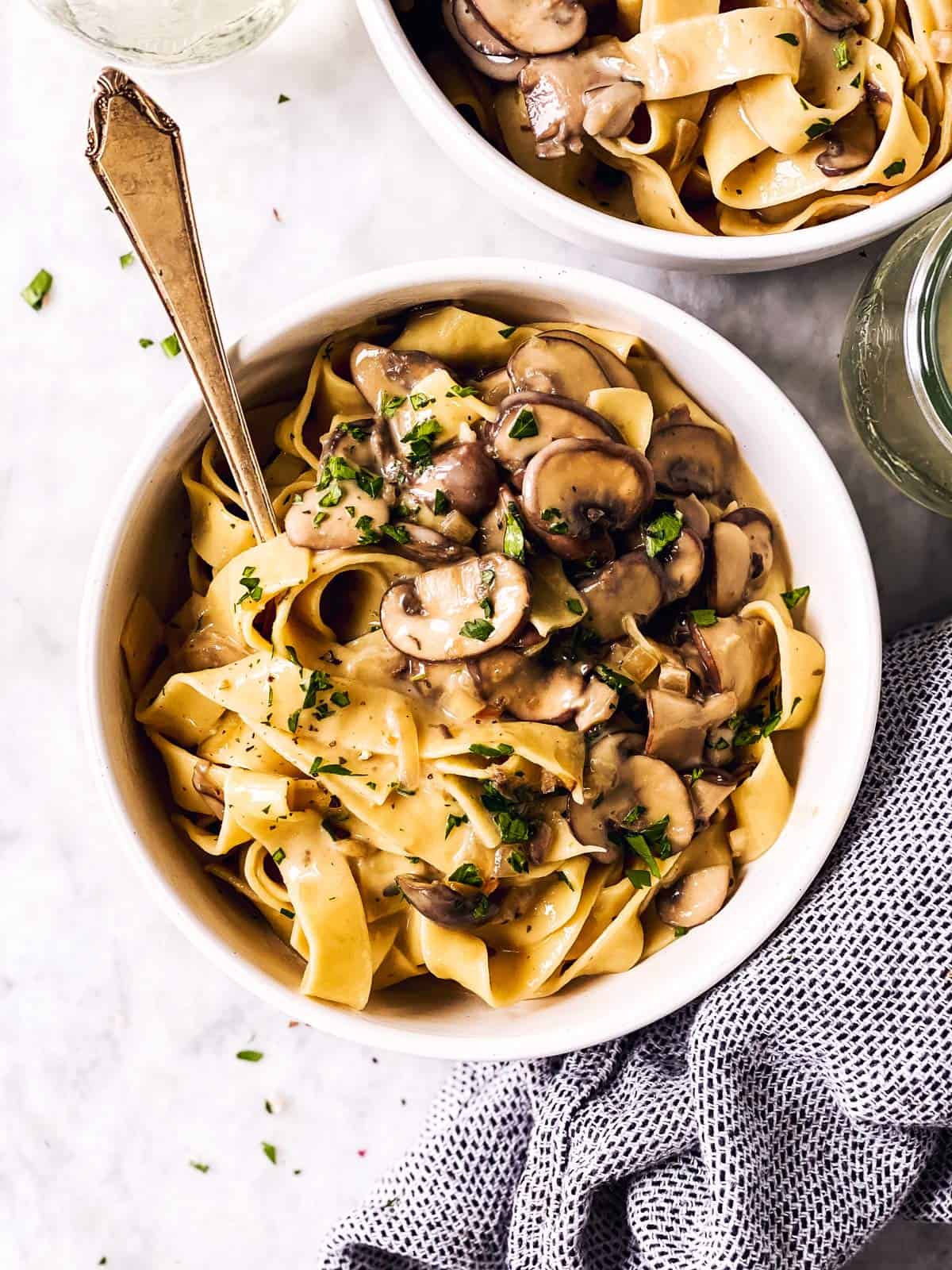 overhead view of a white bowl with mushroom stroganoff