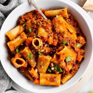 white bowl with rigatoni bolognese