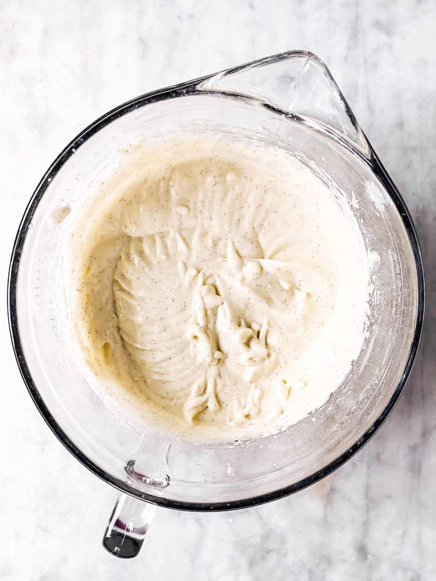 cream cheese frosting in glass bowl