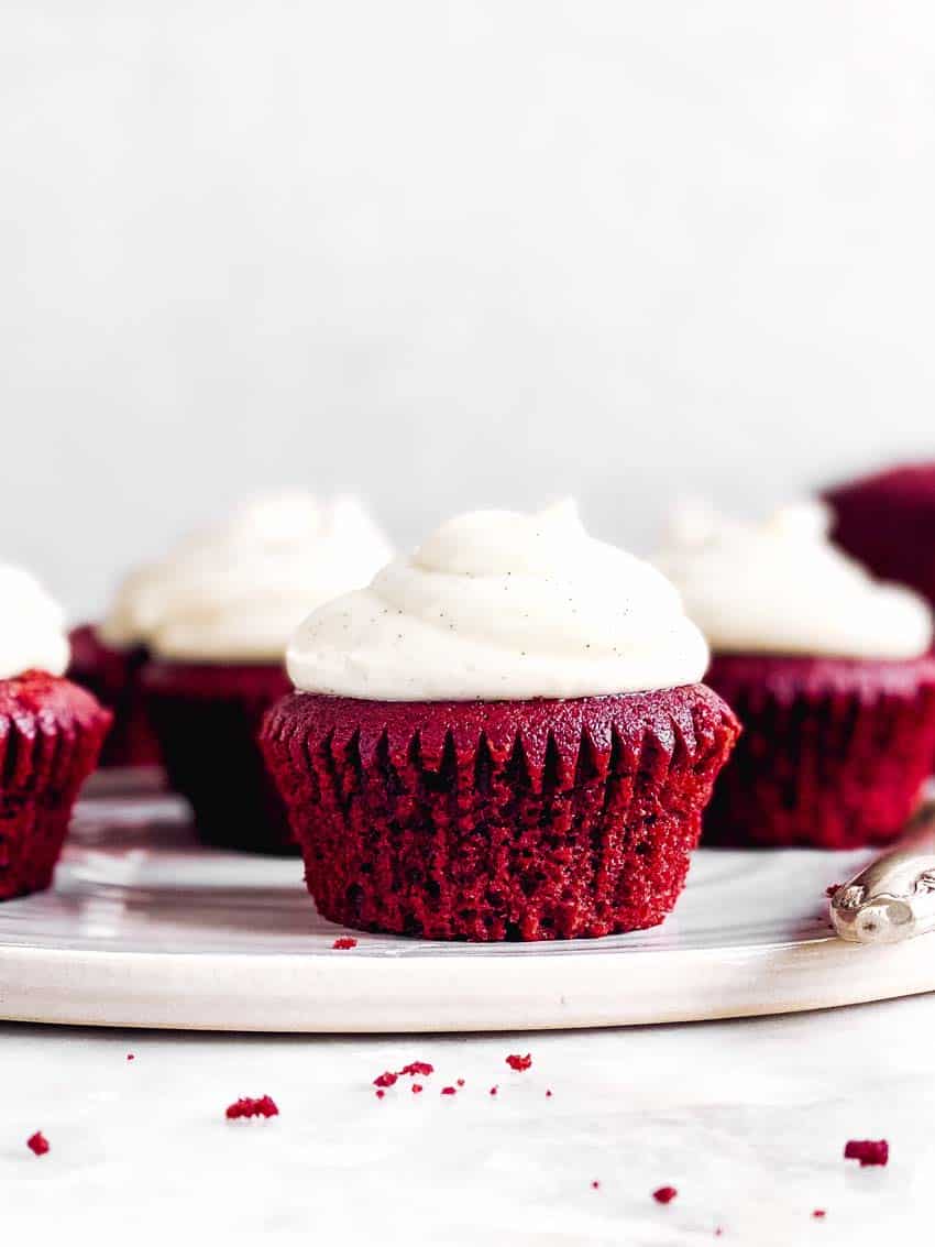 frosted red velvet cupcakes on serving platter
