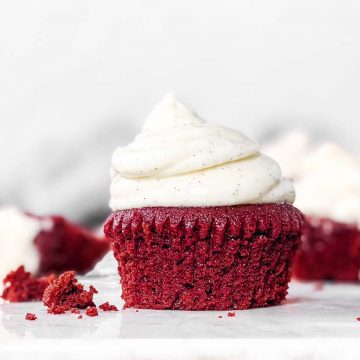 red velvet cupcake with cream cheese frosting on countertop