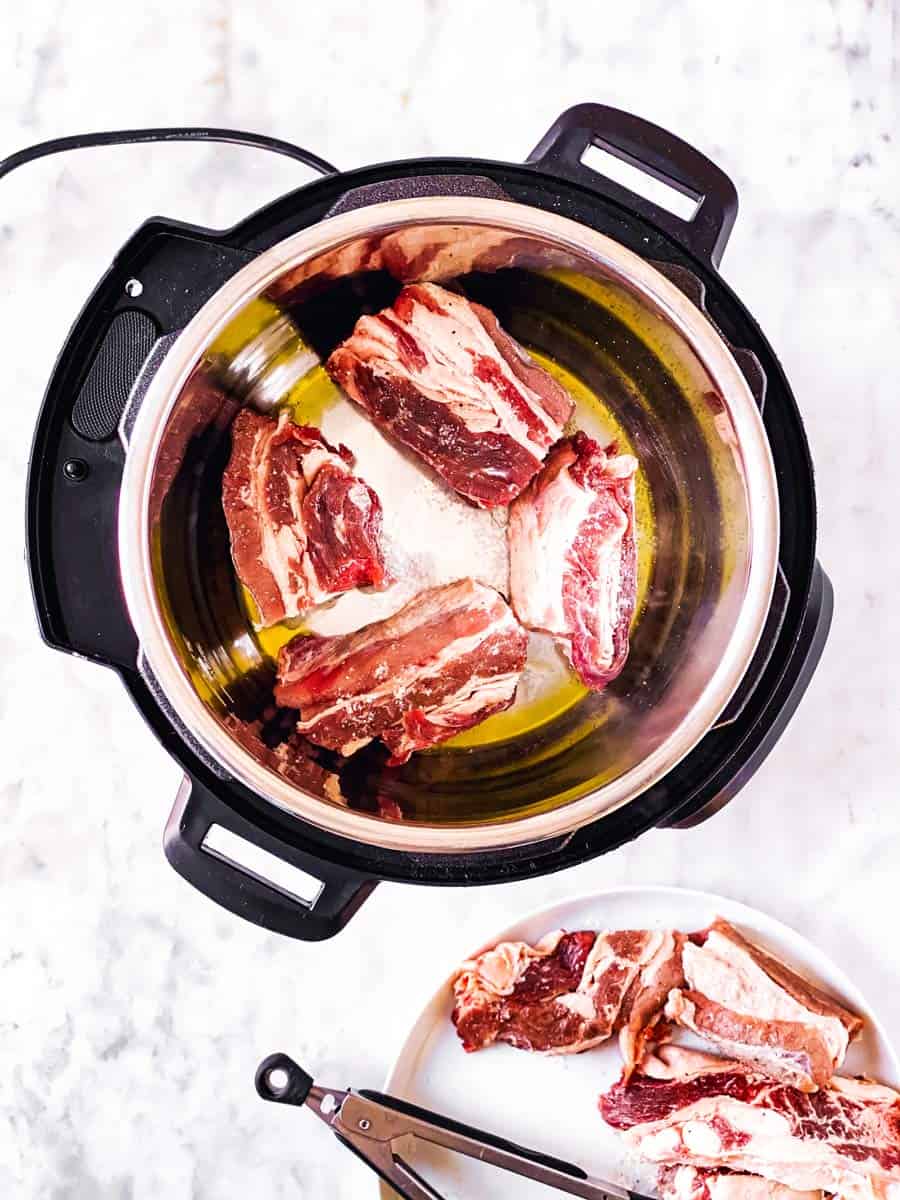 overhead view of instant pot with short ribs inside