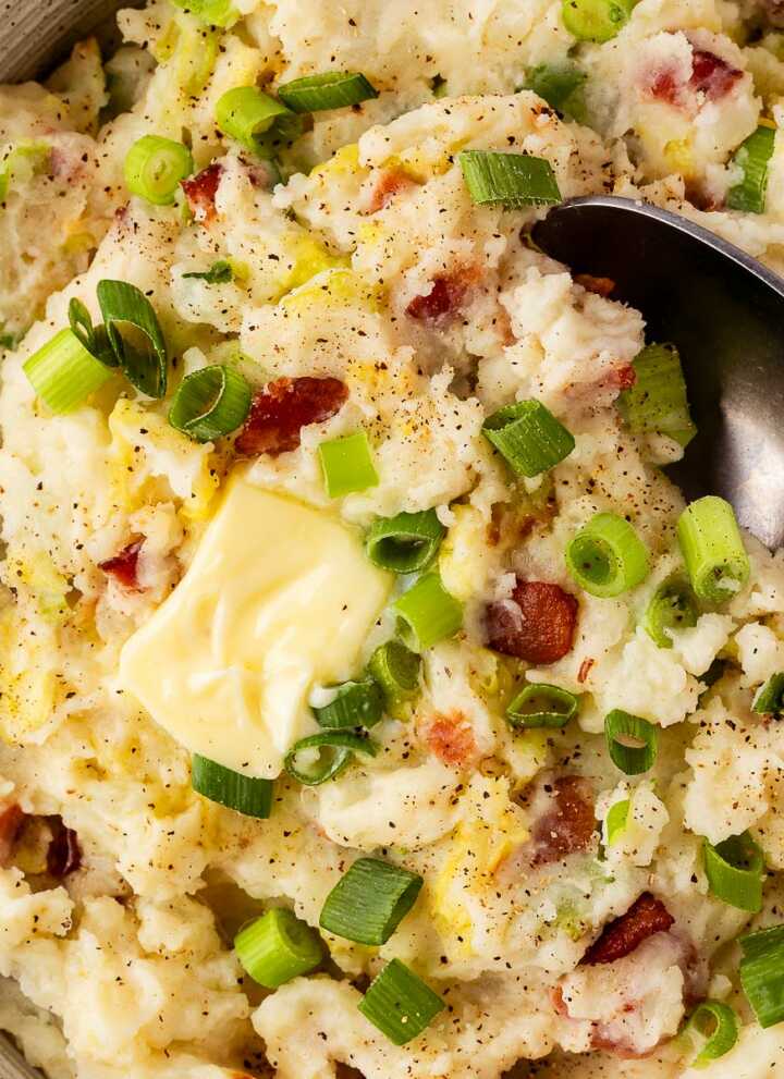 overhead view of colcannon with butter in bowl
