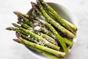 asparagus seasoned with olive oil, salt, pepper and parmesan cheese