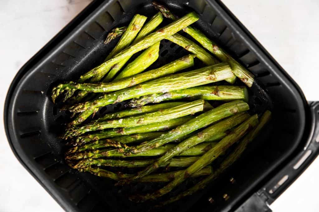 cooked asparagus in air fryer basket