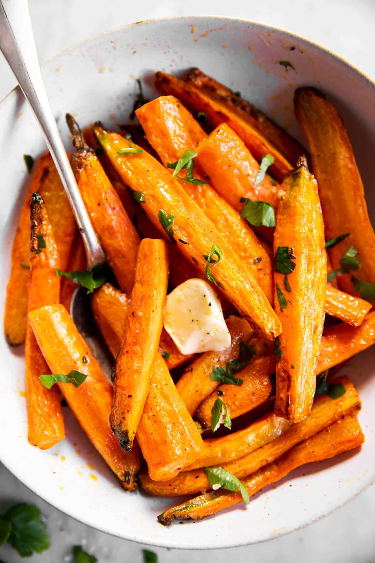 overhead close up of air fryer carrots in white bowl