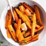 overhead view of air fryer carrots in white bowl