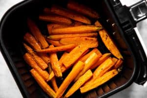 cooked carrots in air fryer basket