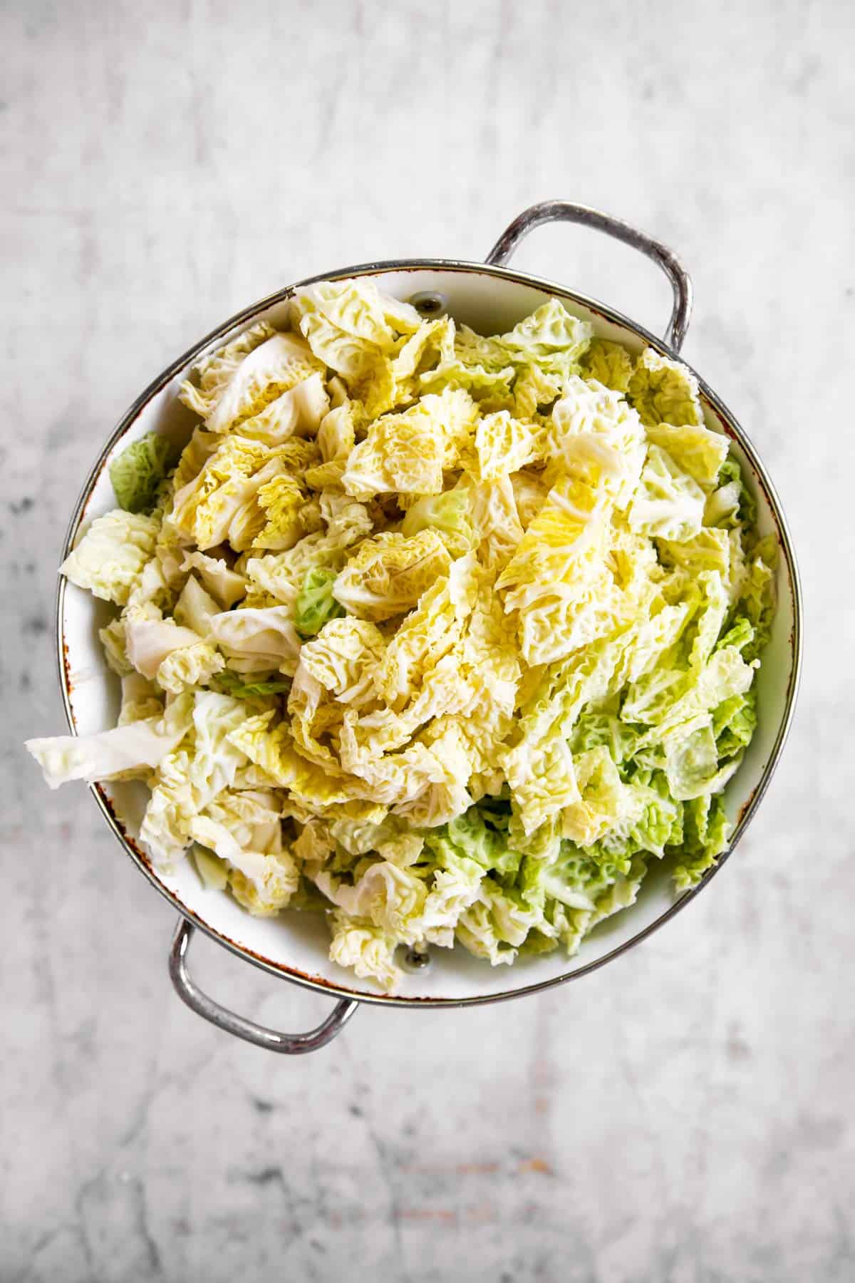 diced and washed cabbage in white colander
