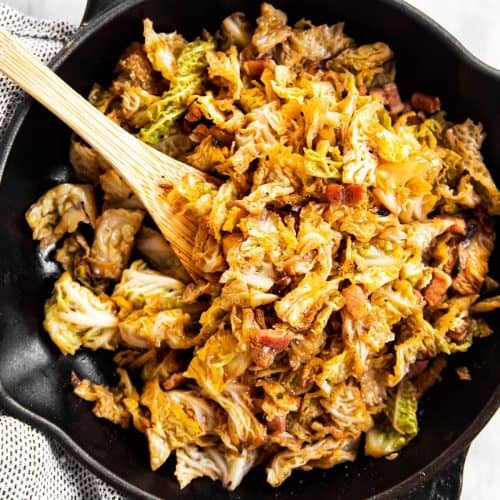 bacon braised cabbage in black cast iron skillet