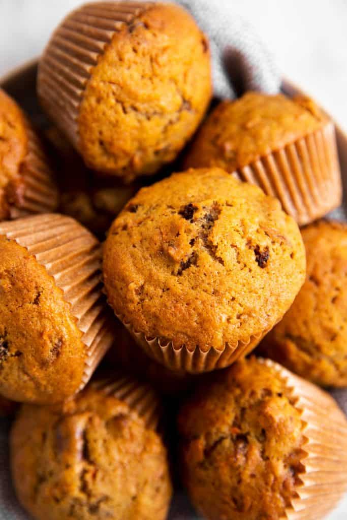 close up photo of carrot muffins on plate