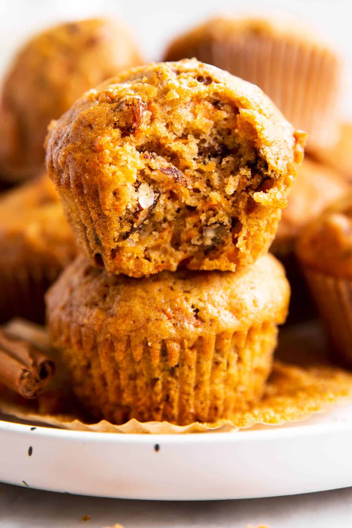 stack of carrot muffins on white plate