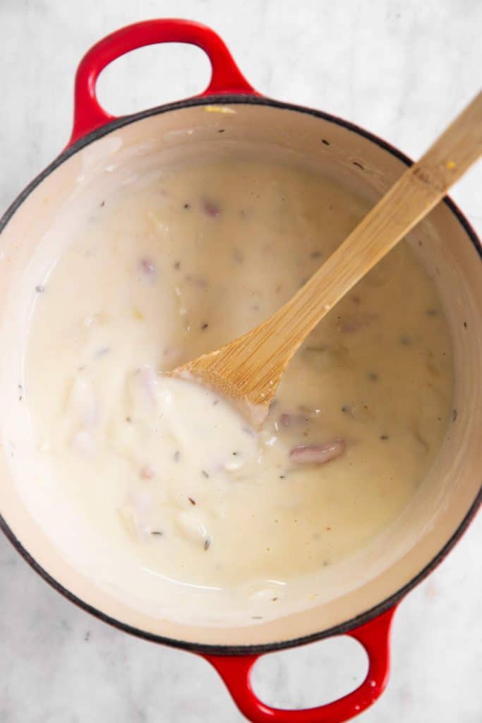 homemade bechamel sauce in cast iron pot