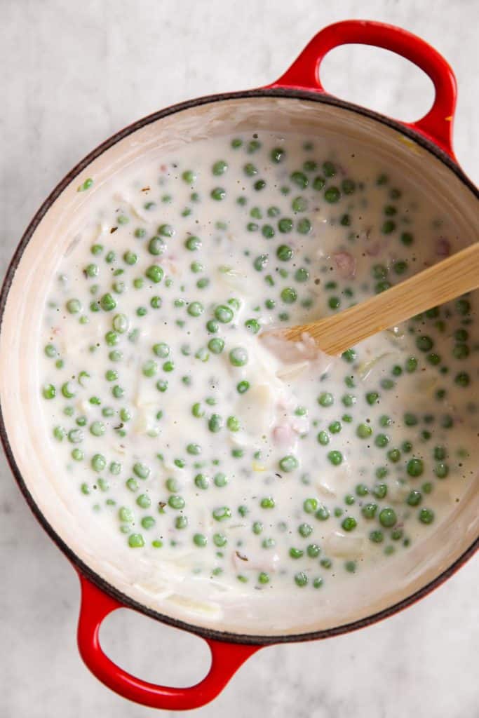 creamed peas in cast iron pot