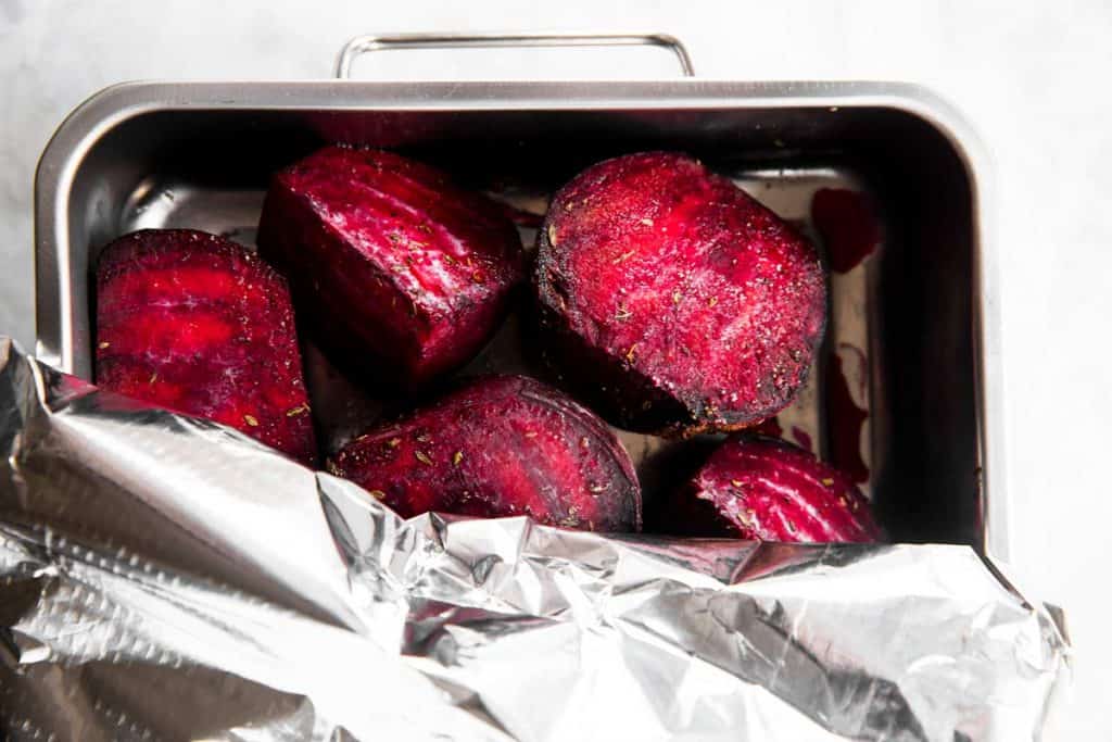 covering beets in roasting pan with foil