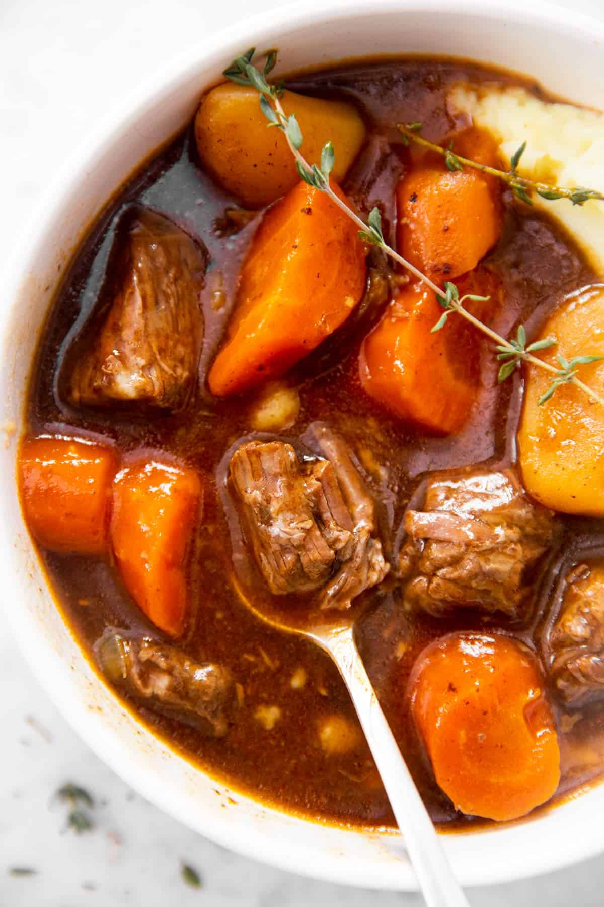 close up photo of spoon in Irish stew