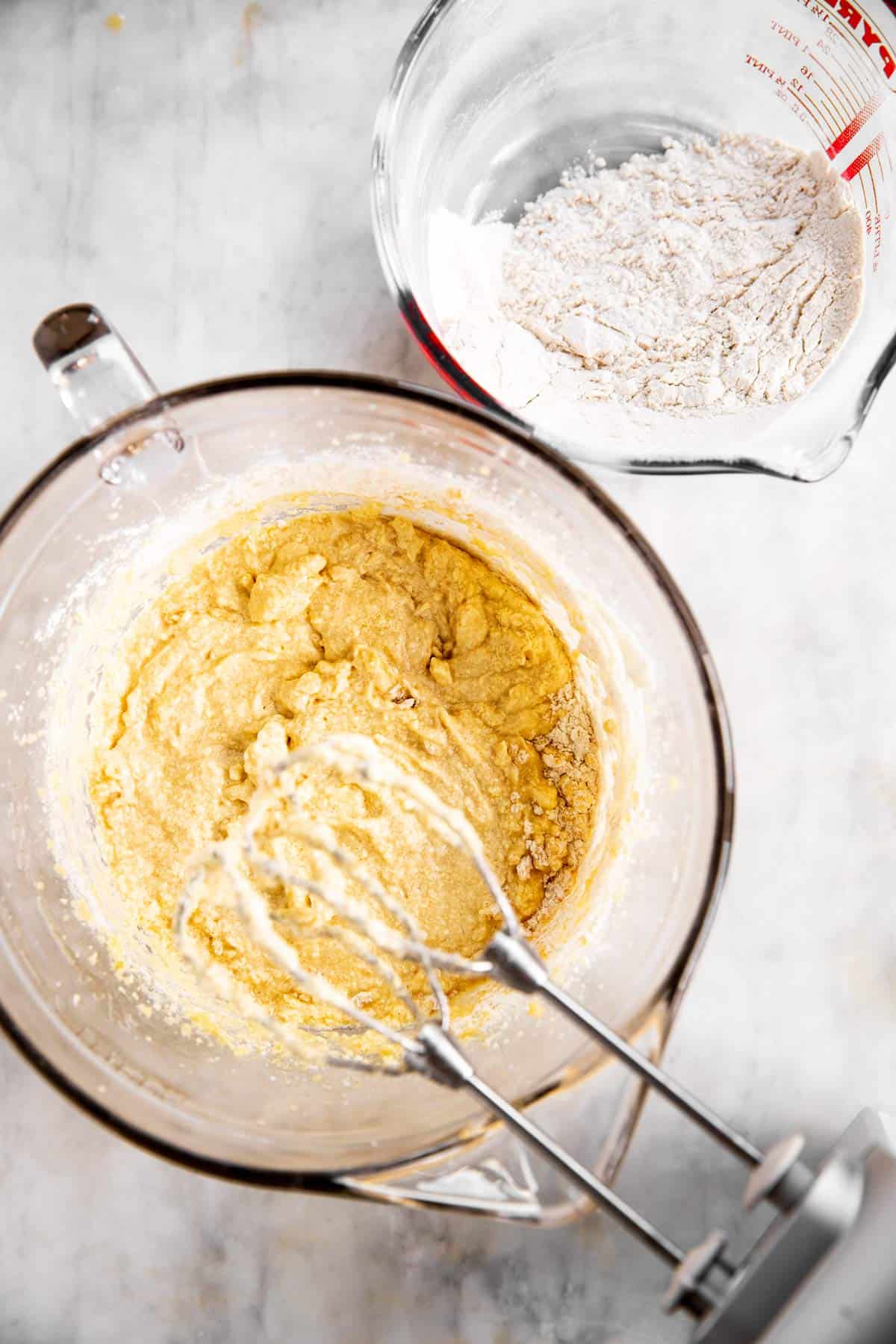 bowls with dry ingredients and creamed ingredients to make cake batter