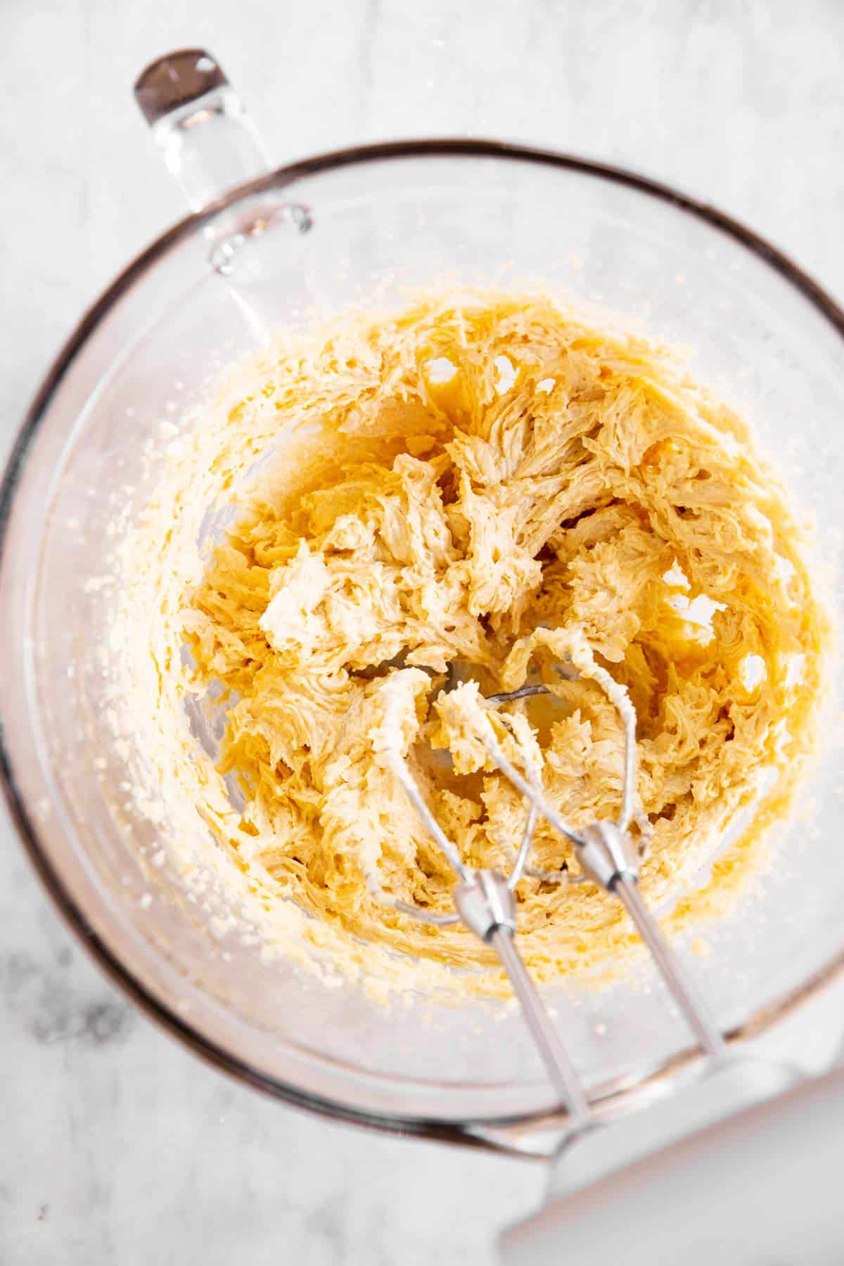 glass bowl with creamed butter, sugar and eggs