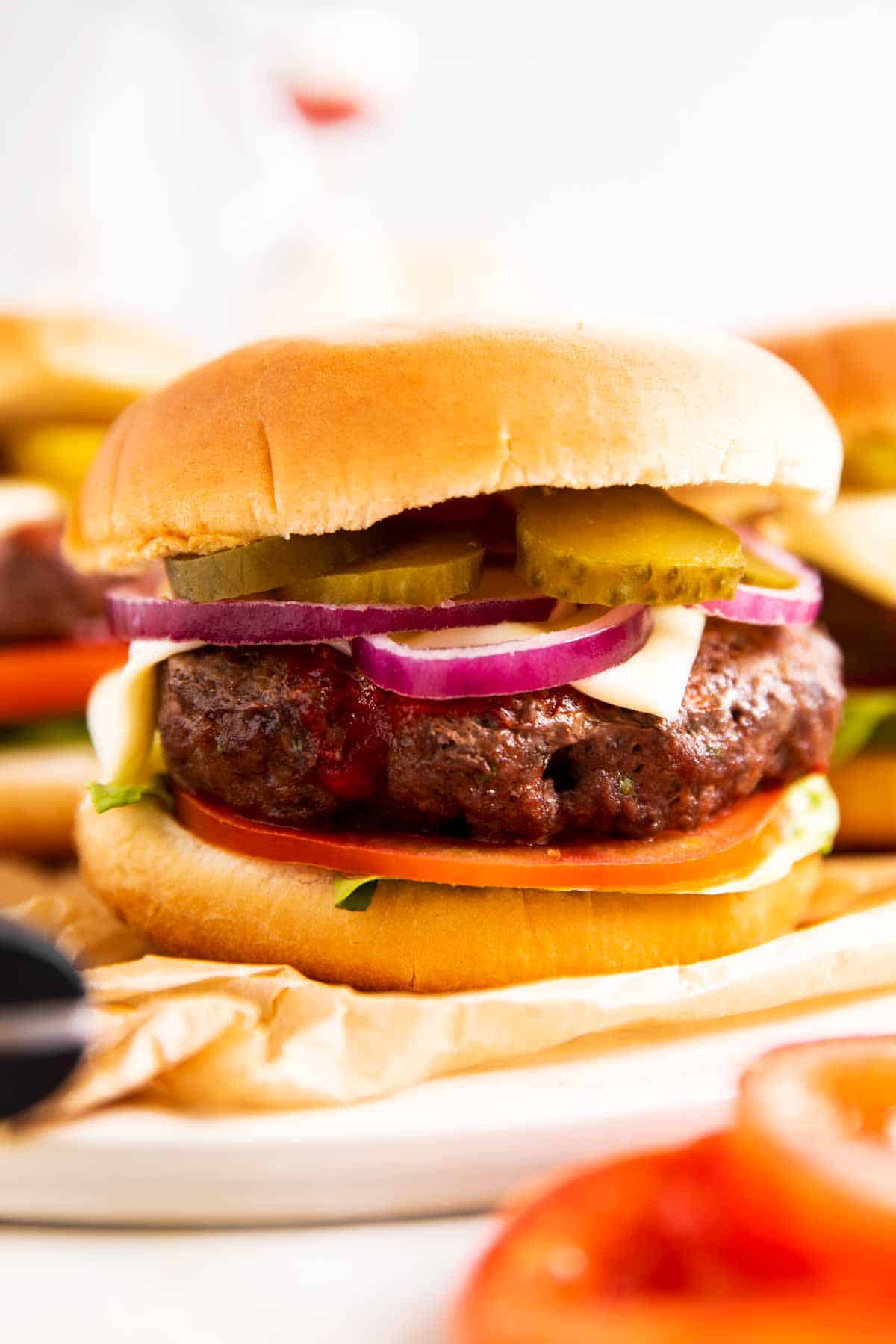 burger on platter with water bottle in background