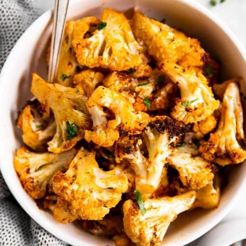 overhead view of air fryer cauliflower in white bowl