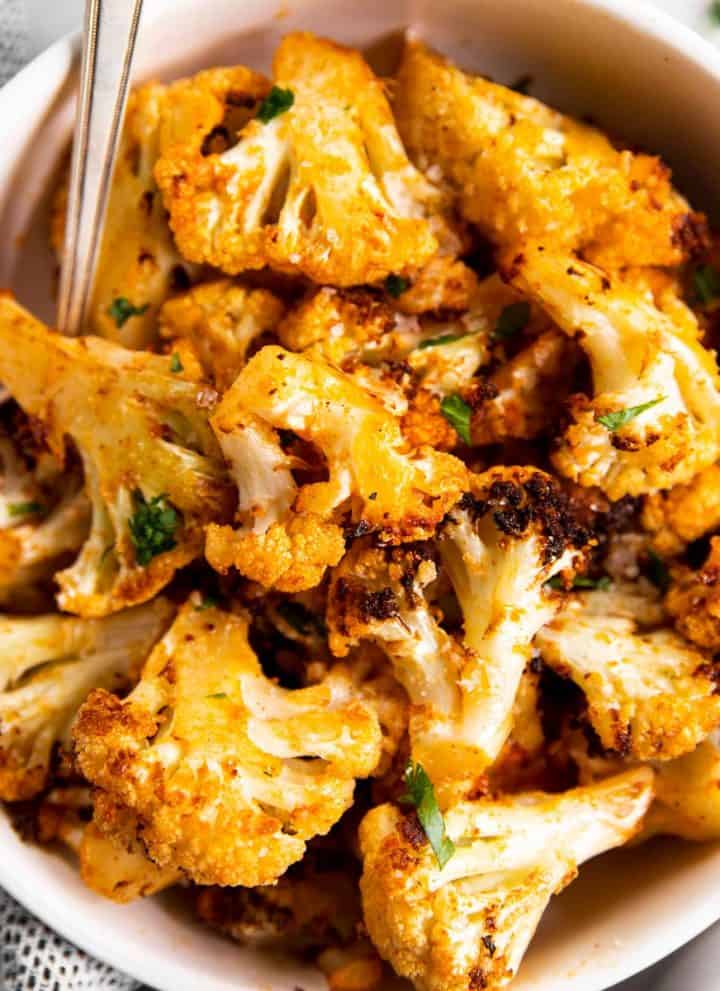 overhead view of air fryer cauliflower in white bowl
