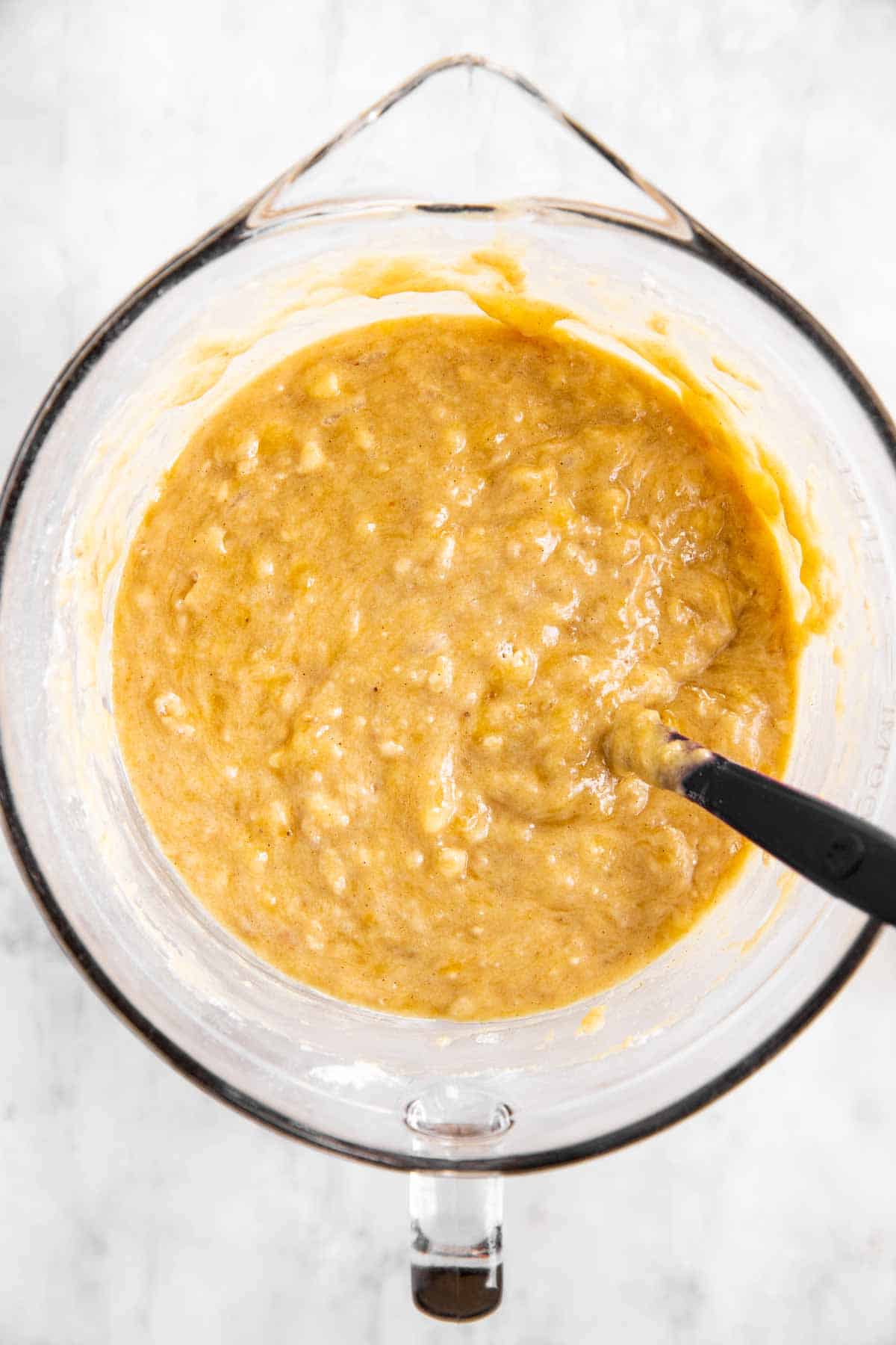 banana bread batter in glass bowl