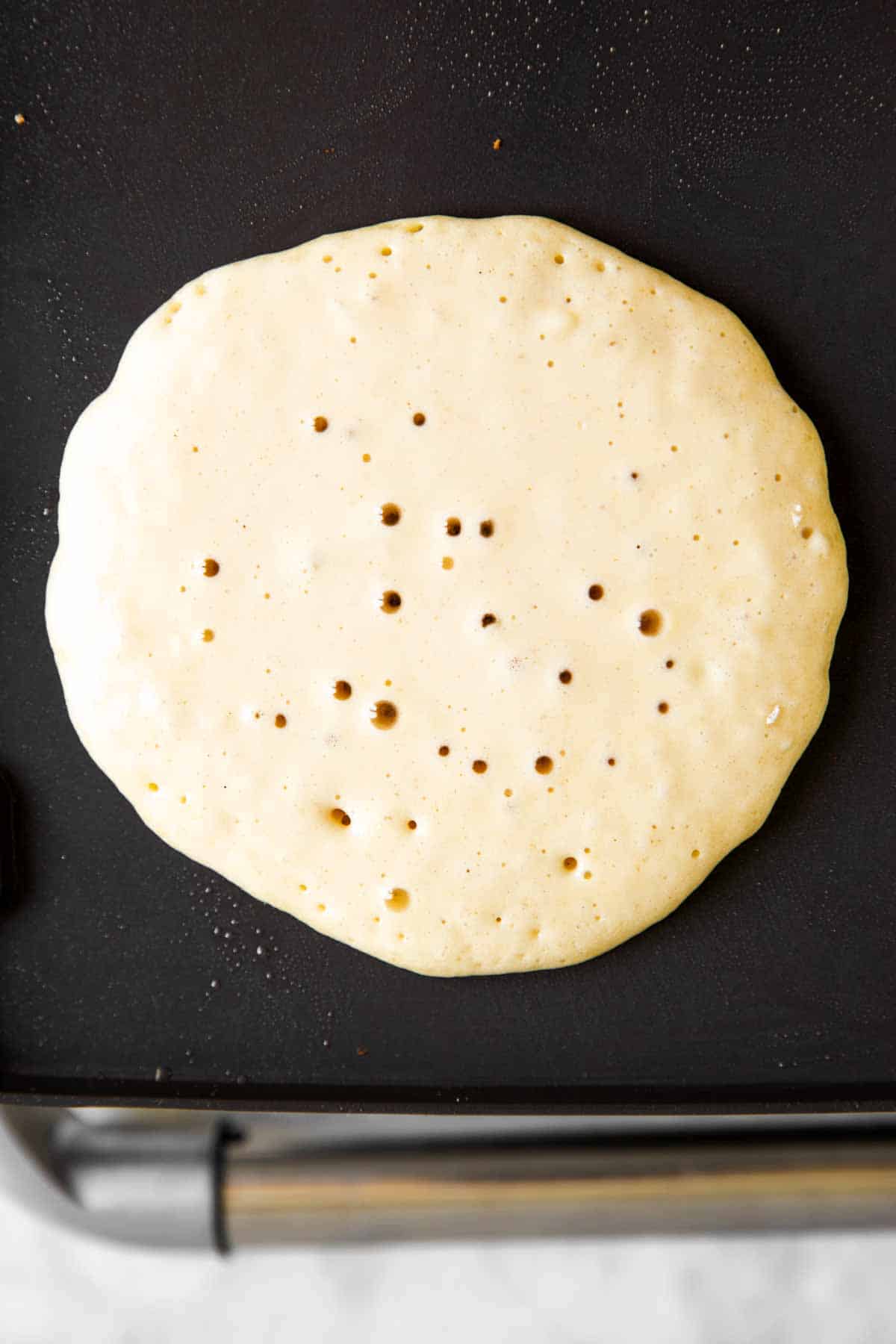 pancake batter on griddle