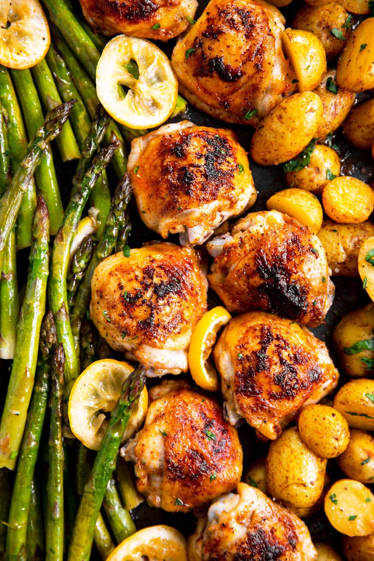 close up photo of chicken and asparagus sheet pan dinner